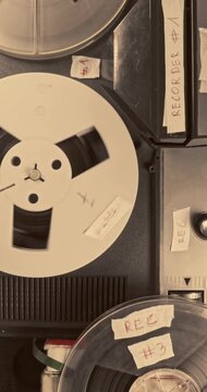 Vintage reel audio recorder and tape rolls. Audio reel player.