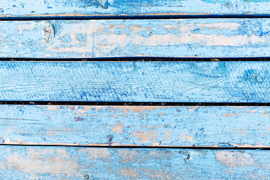 surface of blue painted wooden boardwalk