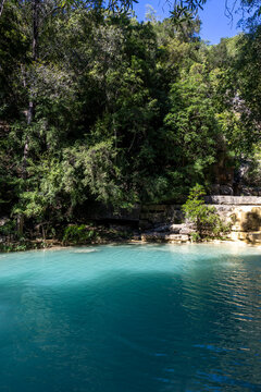 Turquoise natural pool surrounded by forest, Tsiribihina, Madagascar