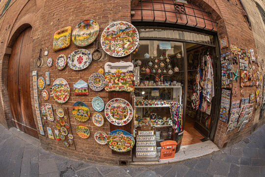 Siena, Tuscany, Italy - May 23, 2026: The facade of a traditional shop selling handicrafts, ceramics and souvenirs, in the historic center. 