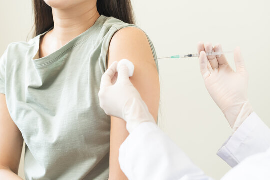 Health care, corona virus, hand of woman nurse, doctor giving syringe vaccine, injection dose on arm sick patient at clinic. Vaccination, immunization disease prevention against flu pandemic influenza
