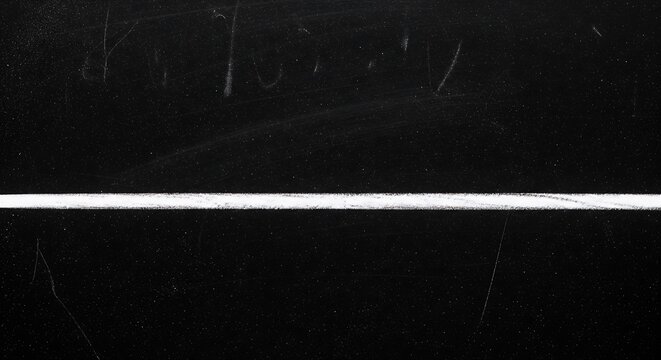 Single white horizontal line on a textured dark black chalkboard background with subtle chalk dust remnants