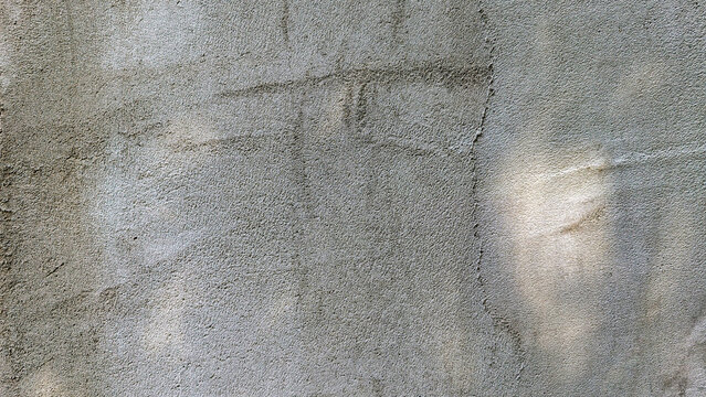 Rough concrete wall background showing textured stucco surface, reflecting urban construction, durability, and raw material strength for design projects