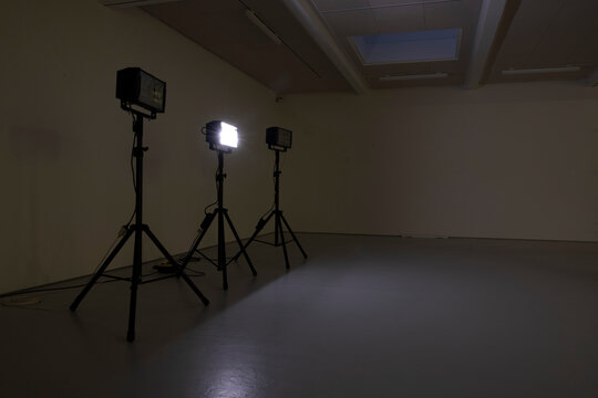 Studio lights in an empty indoor space