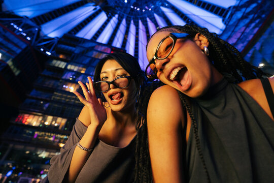 Two Friends Laughing at Night