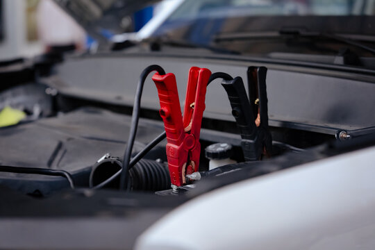 Jumper Clamps Under Car Hood