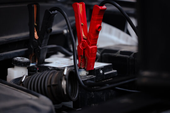 Jumper Cables on Car Battery