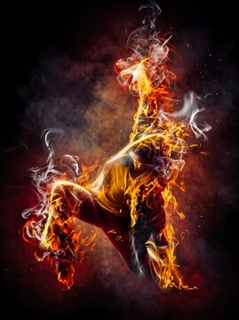 Dynamic breakdancer engulfed in flames and smoke performing an energetic dance move