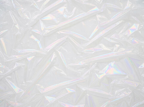 Holographic iridescent crystal glass fragments prism texture rainbow refraction abstract background