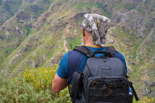 Hiker overlooking ravine, Tenerife