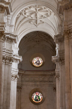 Aisle vault with round stained glass windows in Granada Cathedral