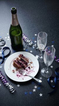 Aftermath of celebration party with cake and champagne