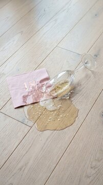Spilled Champagne Glass and 18th Birthday Napkin on Floor