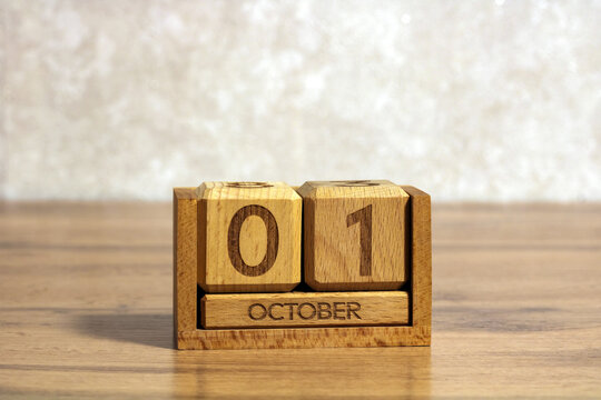 Calendar showing October 1 on wooden blocks, representing first day of month, new beginning, monthly planning, important date and approaching business deadlines
