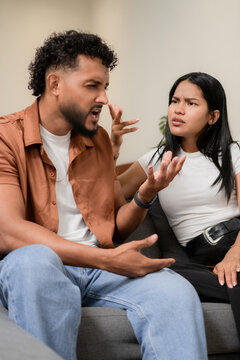 Young couple having argument discussing relationship problems