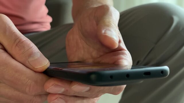 Fingers swiping digital screen display on modern black smartphone close up. Male person using high tech interactive mobile device for scrolling social website timeline. Communication