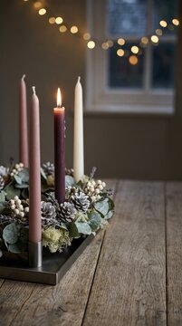 Nordic Advent arrangement: burning candle, holiday wreath, pinecone garnish, wooden table, festive atmosphere, cozy interior, winter solstice, sacred season.