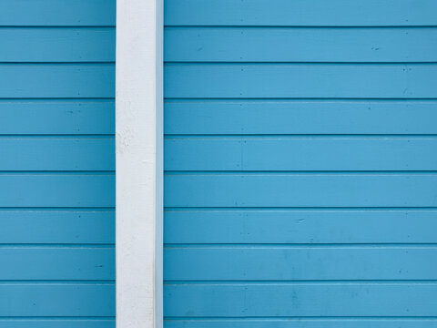 Blue Wooden Wall Siding with White Vertical Trim Bar