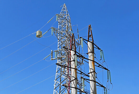 Metal and concrete high-voltage power line pylons
