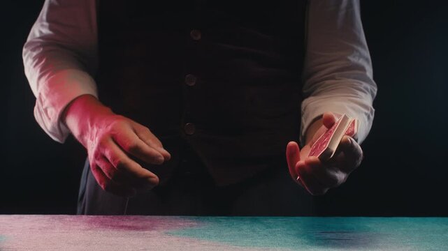 Magic trick, Professional croupier shuffling and dealing playing cards at a casino table, poker and blackjack game, magician performing a card trick shuffling cards deck