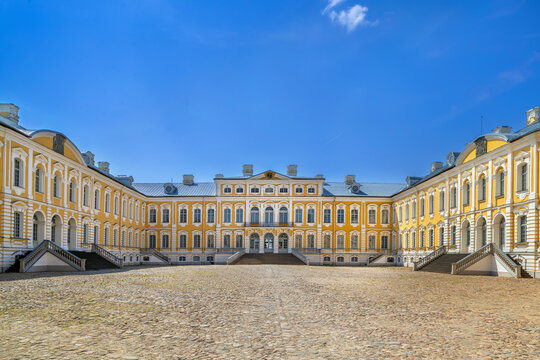 Inner courtyard view of Rundale Palace in Latvia. Baroque and rococo palace architecture under a clear blue sky