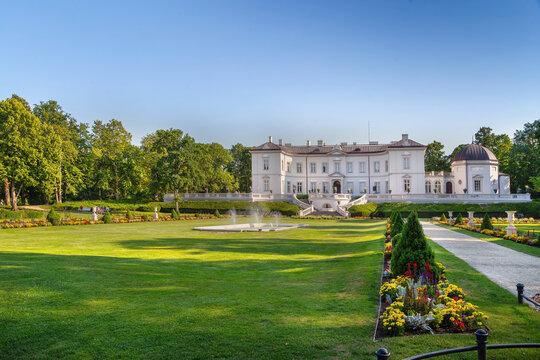 Distant view of Tiskeviciai Palace with flower beds in Palanga, Lithuania. Neorenaissance style under a clear blue sky