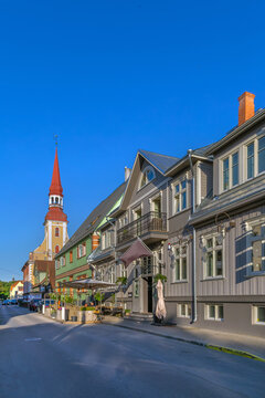 View of Kuninga Street with St. Elizabeth's Church in Parnu, Estonia. Baroque church architecture under a clear blue sky