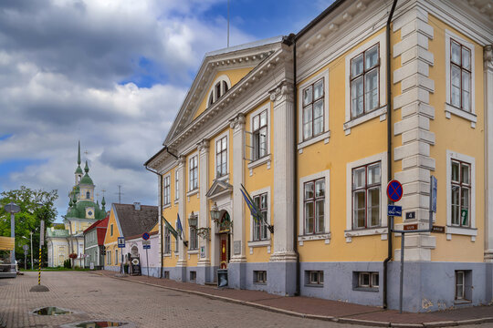 View of Parnu City Gallery and St. Catherine's Church in Parnu, Estonia. Historic architecture under a partly cloudy sky
