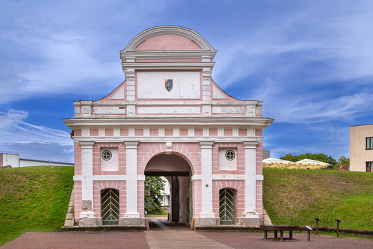 Scenic view of Tallinn Gate in Parnu, Estonia. Historic baroque fortification architecture under a partly cloudy sky
