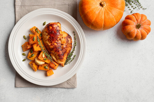 Autumn meal: roasted chicken with pumpkin and herbs