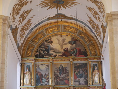 View of the ornate gilded altar and religious paintings inside the Se de Portalegre in Portalegre, Portalegre District, Portugal.