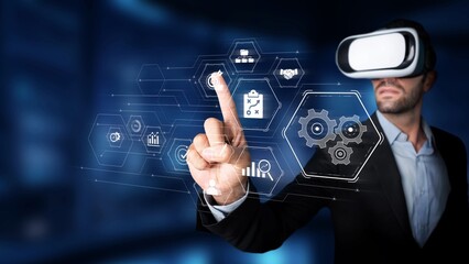 Obraz premium A businessman engages with a virtual reality interface in a modern setting, demonstrating the integration of technology in professional environments and data interaction. Raster
