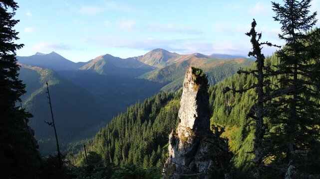 Mnichy Chochołowskie rock towers shrouded in morning mist and clouds in summer, Western Tatra Mountains
