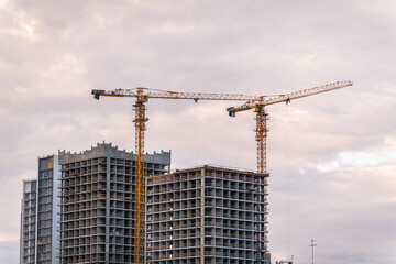 Tower crane at a construction site against the sky © Dmitrii Potashkin