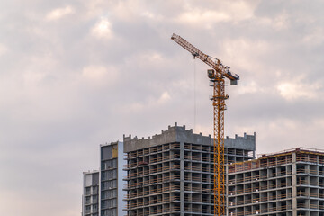Tower crane at a construction site against the sky © Dmitrii Potashkin