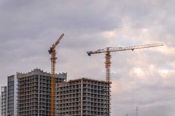 Tower crane at a construction site against the sky © Dmitrii Potashkin