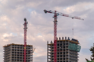 Tower crane at a construction site against the sky © Dmitrii Potashkin