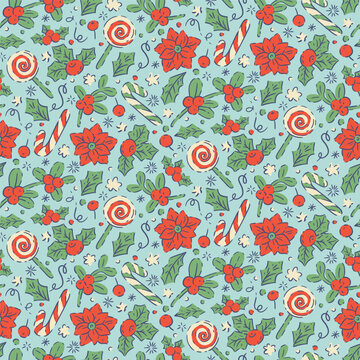 Seamless pattern with red poinsettia, holly berries and candy swirls on blue background
