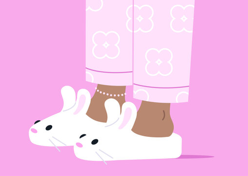 Soft bunny slippers hug warm feet, set against a gentle pink backdrop, creating a cozy and cheerful scene ideal for lazy afternoons.