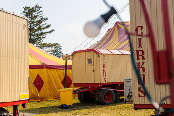 Empty Traveling Circus Site With Colorful Red And Yellow Tent And Service Trailers © Olga