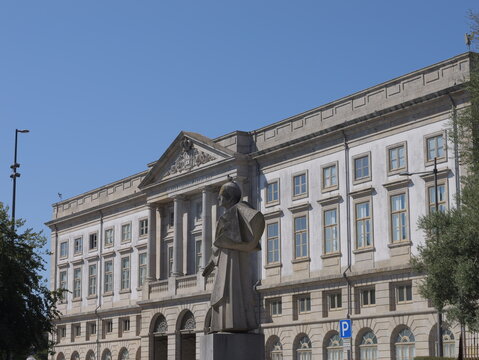 View of the neoclassical architecture of the Museu de Historia Natural e da Ciencia da Universidade with a statue in the foreground in Porto, Porto District, Portugal.