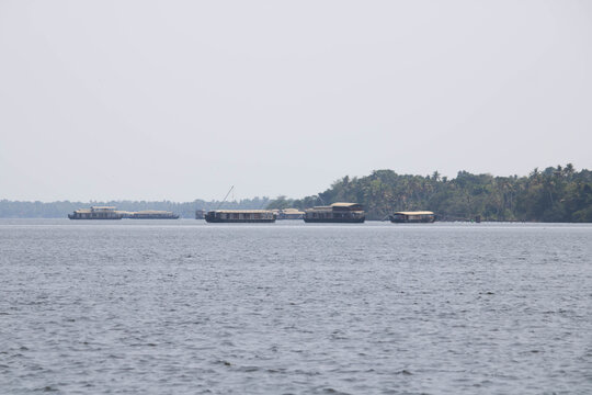 Traditional houseboat cruising on serene backwaters in Alleppey Kerala