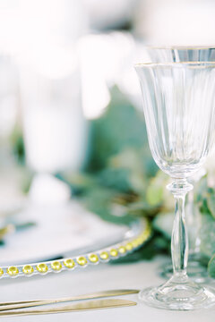 Elegant wedding dinner table setting with glassware