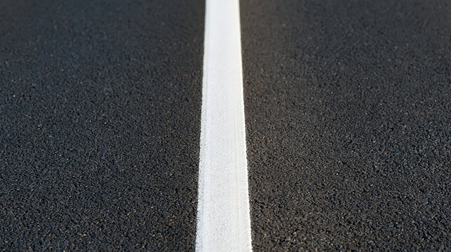 Road strip and line on asphalt, close-up texture, with copy space