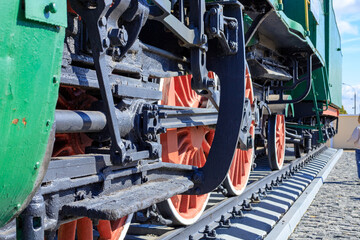 Mechanical Drive Rods and Huge Wheels of Steam Engine Locomotive for Heavy Engineering Concept © yaviki