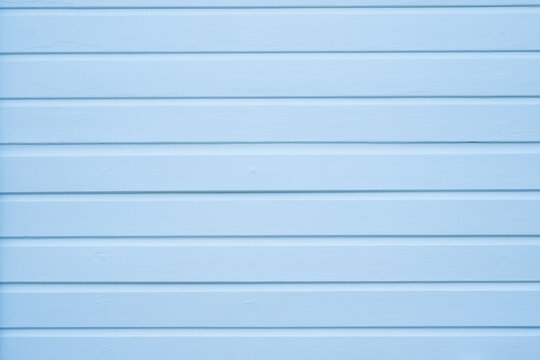 Pale blue painted wooden boards with clean horizontal lines