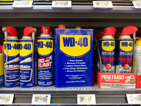 Frisco, Texas, USA - September 14th, 2026: WD-40 multi-use lubricant cans and penetrating spray bottles standing on store shelf