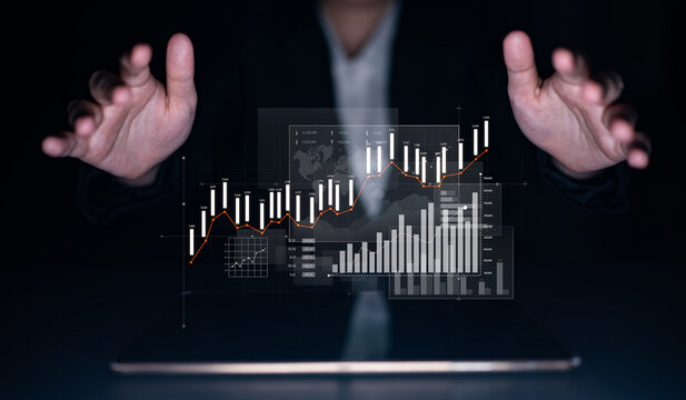 A businessperson showcases digital data analysis with hands extended over a tablet, highlighting graphs and charts that represent financial growth and market trends. Scalp