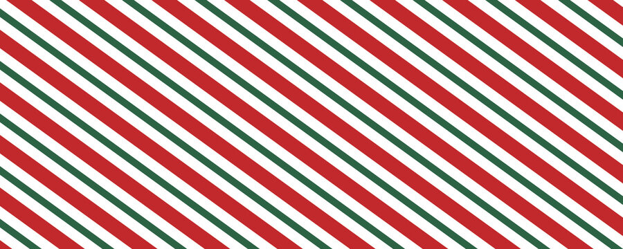 Christmas seamless pattern with a classic candy cane design with alternating red and green diagonal stripes on a white background, perfect for festive holiday themes.