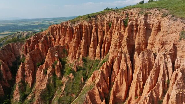 Sandstone earth pyramids Stob pyramids aerial view orange rock formations canyon landscape summer tourism footage